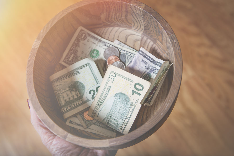 A bowl containing cash donations